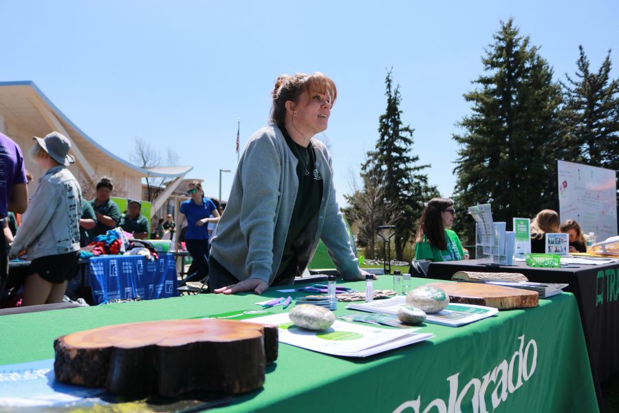 Cassie Mattson waits to talk to students at the Earth day celebration, about forest preservation. (Devin Cornelius | Collegian)