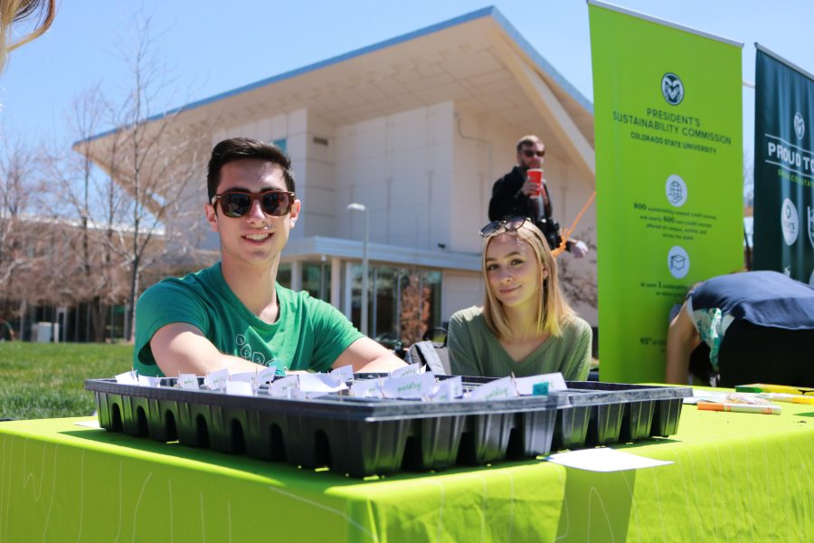CSU Eco leaders Noah Fishman and Sophie Bell smile at their booth during the Earth day celebration. They asked students what the do to help protect the environment. (Devin Cornelius | Collegian)