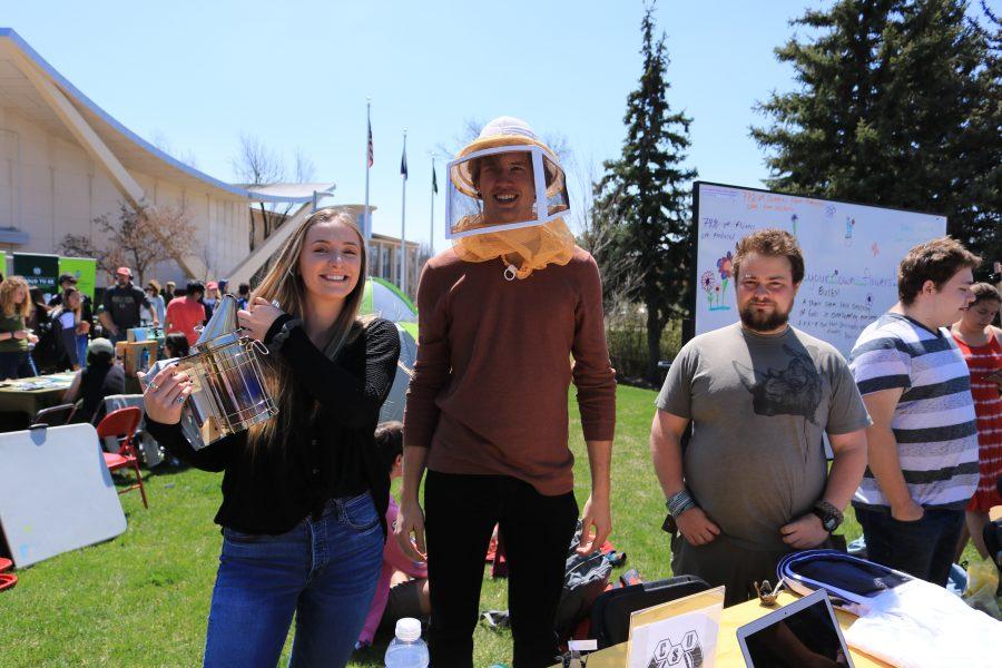 Shannon Kinsella, Freddie Haberecht, and Nolan Bunting pose for the camera while working a booth about bees at the CSU Earth Day Celebration.  Freddie said that "Bees are great ambassadors for the environment". (Devin Cornelius | Collegian)