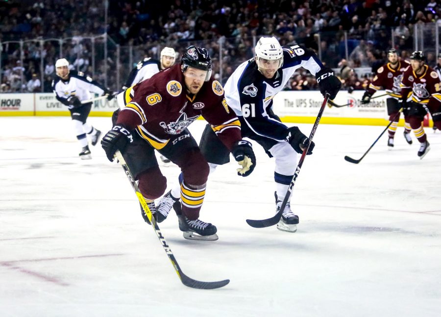 Martin Kaut chases after a Chicago Wolves player during the Colorado Eagles home opener Oct. 5. The Eagles fell to the Wolves both nights of the opening series. (Photo Courtesy of Colorado Eagles)