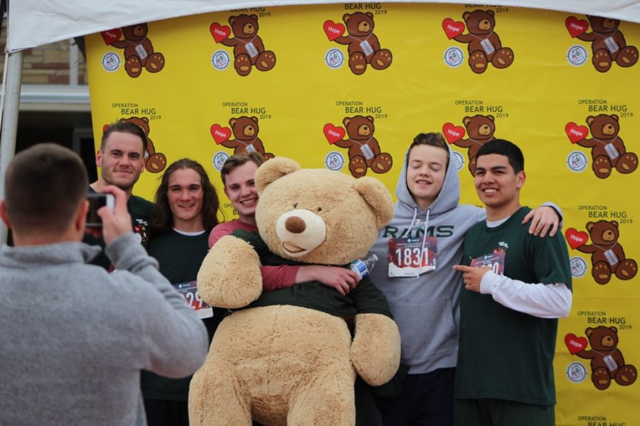 Group Alpha Sigma Phi, taking a photo after finishing the Bear Hug 5k obstacle course. (Joshua Contreras | Collegian)