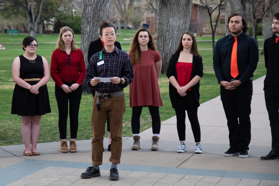 Atlas Tanudjaja, a spiritual care resident at CSU, addresses the audience at Rams Remember Rams in front of Mainstreet Acapella, who performed at the event. (Julia Trowbridge | Collegian)