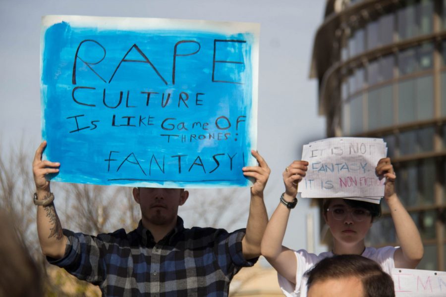 Students standing on the Free Speech Stump with opposing views on rape culture. (Tony Villalobos May| Collegian)