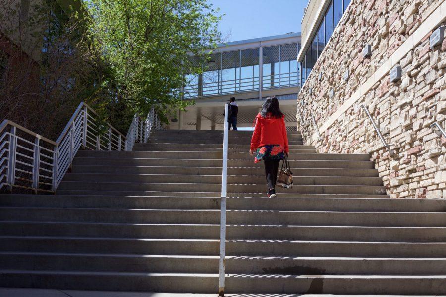 A woman walks up stairs outside near the north side of the LSC May 3. The northern end of the LSC, including the bookstore and the Adult Learner and Veteran Services center, might be part of a planned renovation. (Ryan Schmidt | Collegian)

