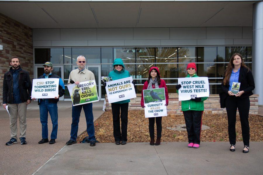 Animal activists and people associated with the People for the Ethical Treatment of Animals stand outside the Translational Medical Center to protest West Nile research on crows. (Julia Trowbridge | Collegian)