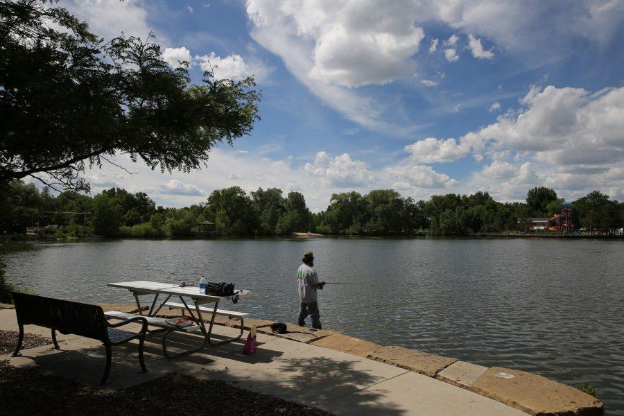 Matt McCune casts out his fishing line June 19 at City Park as temperatures climbed into the 80s and mostly sunny skies held out for the afternoon. Fort Collins is expected to see thunderstorms later in the week followed by sunny weather and temperatures back in the 80s. (Forrest Czarnecki | Collegian)