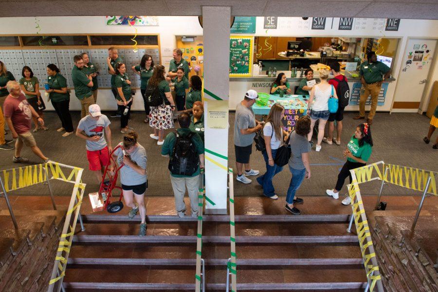 Housing and Dining services staff prepare to greet President Joyce McConnell in Newsom Hall Aug 22. (Matt Tackett | Collegian)