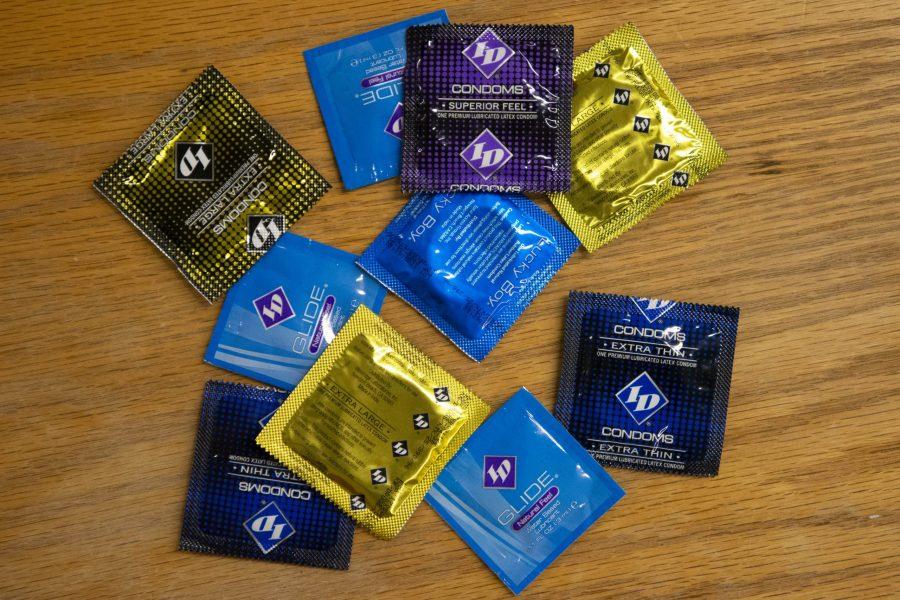 Condoms laying in pile on a table. (Photo Illustration by Matt Tackett)