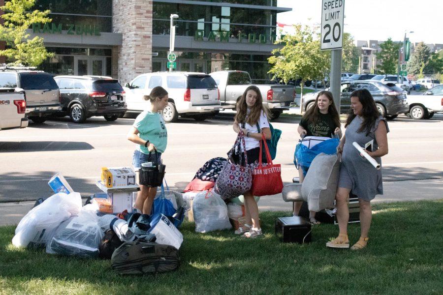 Incoming Colorado State University student Molly Kessler (second from left) moves into Newsom Hall on Aug. 22 with the help of family and a Fraternity and Sorority member. (Anna von Pechmann | Collegian) 