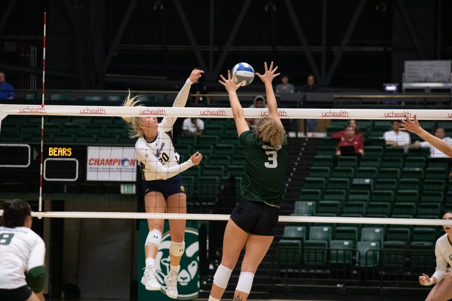 Olivia Nicholson(3) jumps up to block a spike, during CSU's home game against the University of California at Berkeley. The Rams lose to the Golden Bears three sets to one. (Devin Cornelius | Collegian)