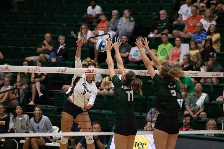 Paulina Hougaard-Jensen (11) and Olivia Nicholson (3) jump to block the ball, as CSU plays UC Berkeley at home. CSU falls three sets to one.(Devin Cornelius | Collegian)