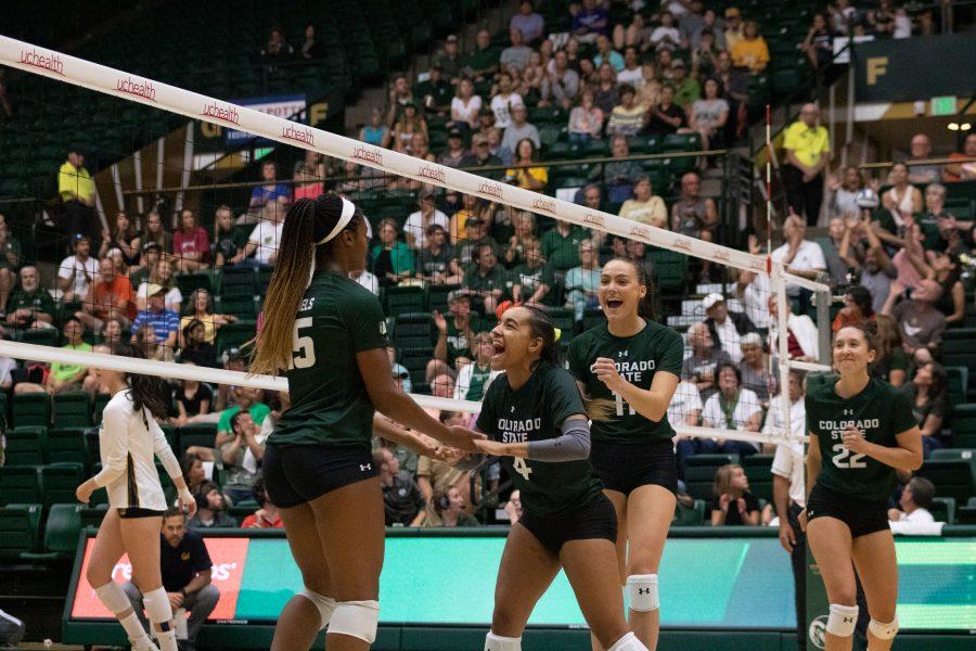 Breana Runnels(15) and Brooke Hudson(4) celebrate a score, during CSU's game against the California Golden Bears at Moby Arena. The Rams lose the match three sets to one. (Devin Cornelius | Collegian)