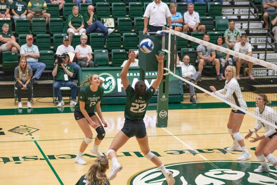 Katie Oleksak (22) sets Sasha Colombo (7) during CSU's game against the California Golden Bears at home. The Rams fall by two sets to the Golden Bears. (Devin Cornelius | Collegian)