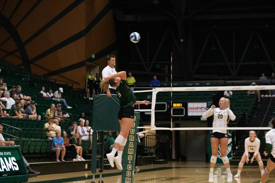 Olivia Nicholson (3) spikes the ball from the outside, during (Devin Cornelius | Collegian)