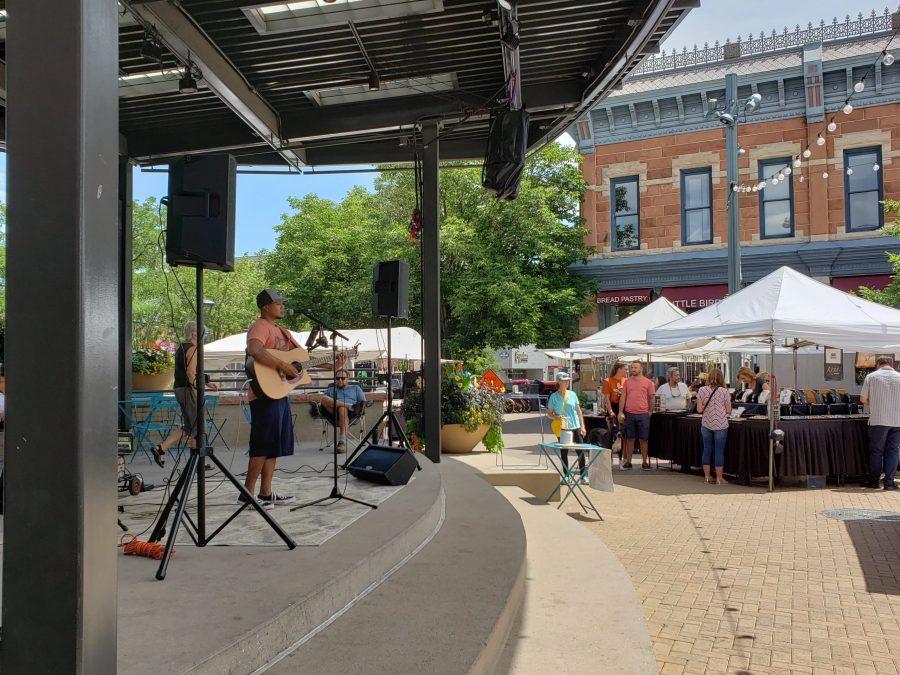 A musician plays for vendors and customers at Art in the Square 2019 (Collegian | Graham Shapley)