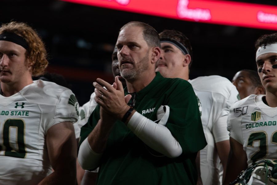 Mike Bobo claps for the Colorado State University Football Team, along with the crowd of fans, after losing the Rocky Mountain Showdown on Aug. 31. (Anna von Pechmann | Collegian)