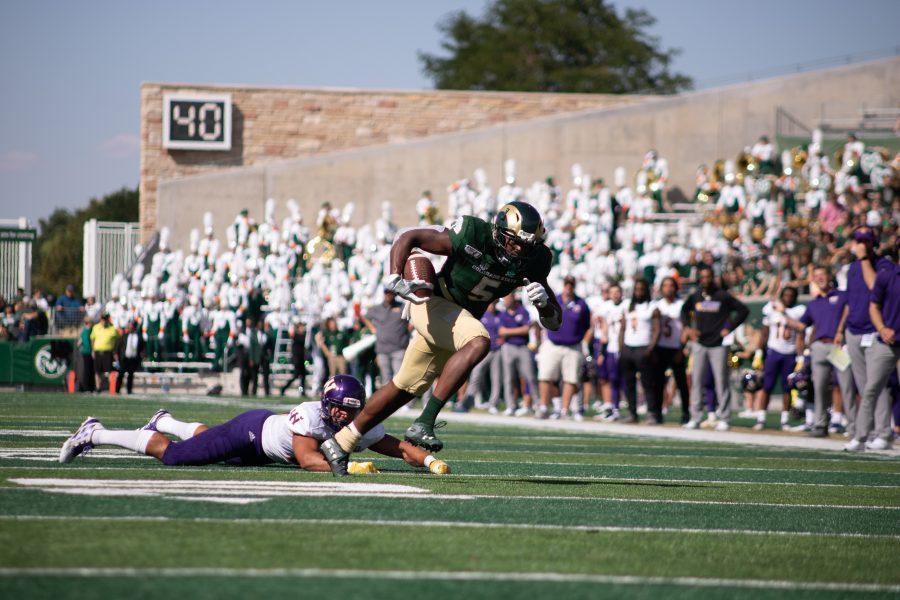 Marvin Kinsey Jr. (5) runs over a defender and scores a touchdown during CSU's home opener against Western Illinois. CSU wins 38-13. (Devin Cornelius | Collegian)