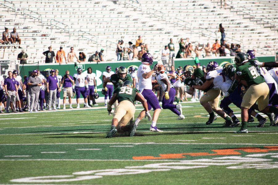 Manny Jones (33) dives to make a tackle on WIU's quarterback, during the CSU's first home game of the season. The Rams defeat Western Illinois University 38-13. (Devin Cornelius | Collegian)