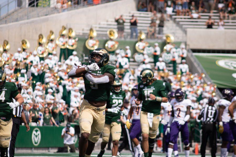Marvin Kinsey Jr. (5) holds up an X sign to the crowd during Colorado States first home game, against Western Illinois. CSU wins 38-13. (Devin Cornelius | Collegian)