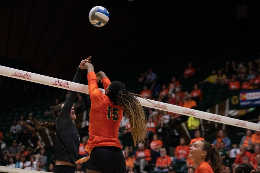 Breana Runnels (15) attempts to bat the ball back toward the University of Colorado Boulder players, during the Colorado State home Orange Out game against the Buffs. Colorado State sweeps Boulder three sets to zero. (Devin Cornelius | Collegian)