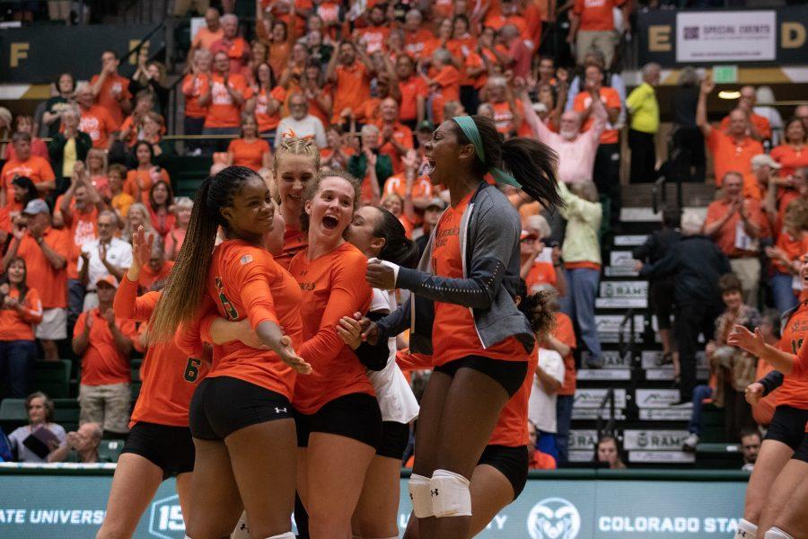 The Colorado State Volleyball team celebrates after defeating the University of Colorado at Boulder, during the orange out game at Moby arena. The Rams won three sets to zero. (Devin Cornelius | Collegian)