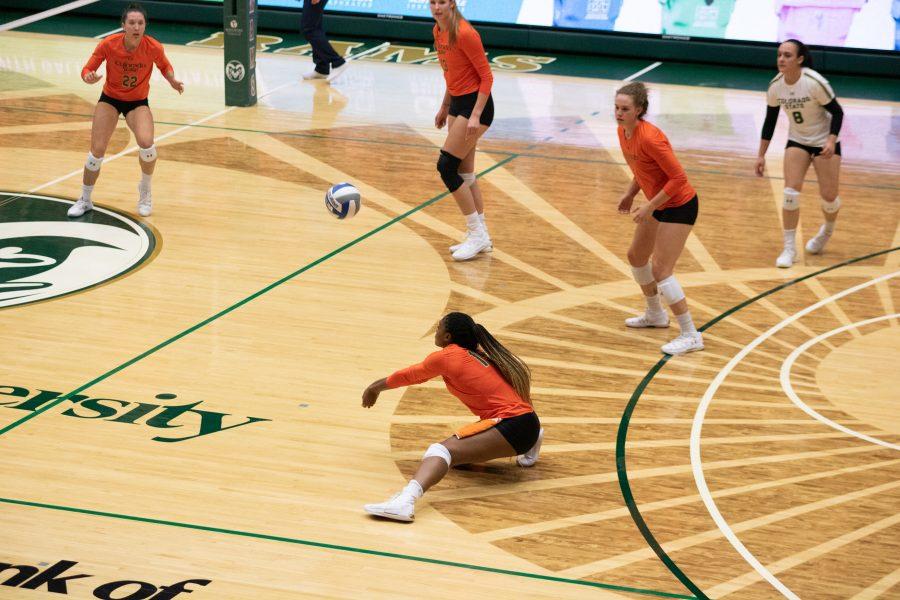 Breana Runnels (15) digs down and bumps the ball towards Katie Oleksak(22) while her teammates watch during Colorado State's home game against the University of Colorado Boulder. The Rams defeat the Buffs three sets to zero. (Devin Cornelius | Collegian)