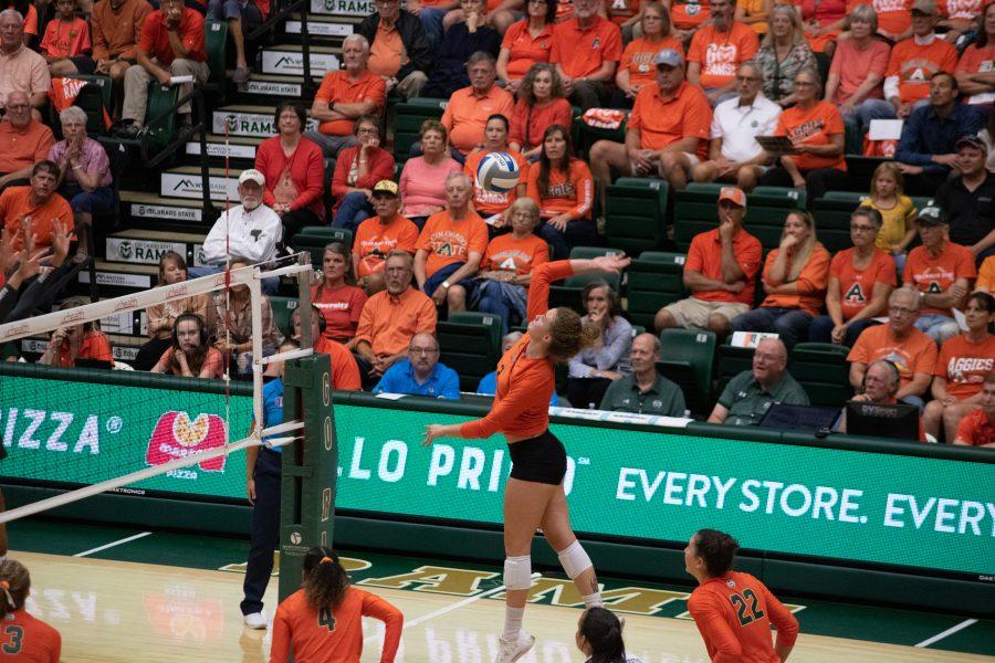 Olivia Nicholson (3) spikes the ball towards her opponents side of the court, during the Orange out game at Moby Arena, as Colorado State takes on the University of Colorado Boulder. The Rams defeat the Buffs three sets to zero. (Devin Cornelius | Collegian)