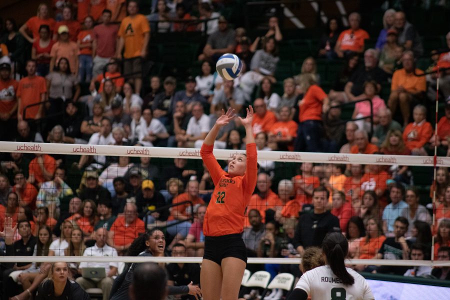 Katie Oleksak (22) sets the ball for her teammates during the Orange out home game against the University of Colorado Boulder Buffs. Colorado State sweeps the Buffs three sets to zero. (Devin Cornelius | Collegian)