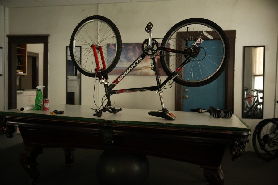 A bike sits on David Stitzels makeshift workbench at his home in central Fort Collins. Stitzel fixes and refurbishes bikes that he reclaims or receives as donations. (Forrest Czarnecki | The Collegian)