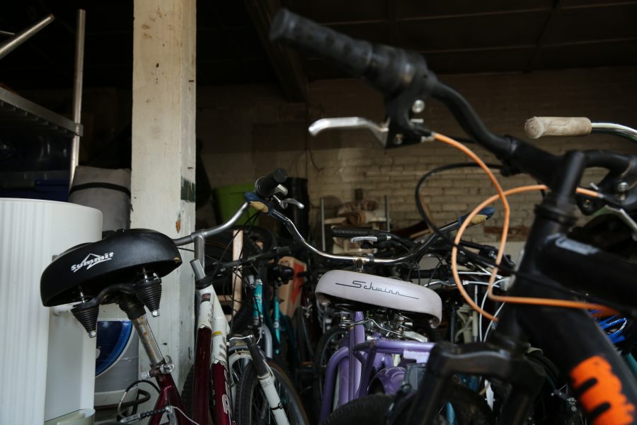 Refurbished bikes wait in a storage garage at the FoCo Cafe. In the nearly two months that Stitzel has been partnering with the Cafe, he has made nearly 20 bikes available for donation. (Forrest Czarnecki | The Collegian)