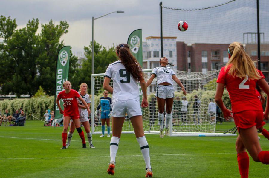 Colorado State University junior defender Lauren Jones (12) heads the ball out of the box against the University of New Mexico Sept. 27. The Rams won in overtime 1-0. (Megan McGregor | The Collegian)