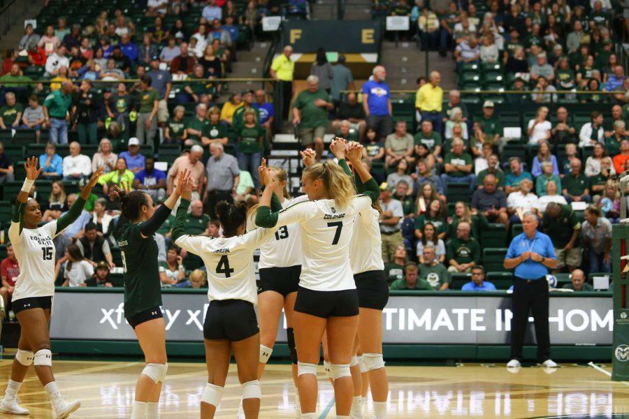 The Rams cheer after winning a point against the University of Northern Colorado Bears.