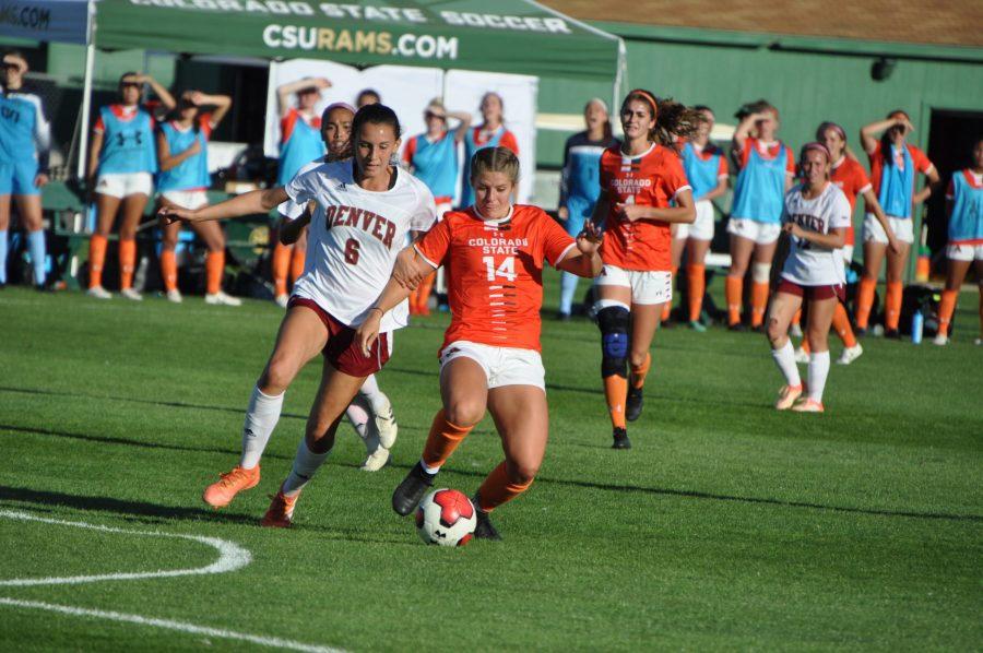 Colorado State senior and midfielder, Caeley Lordemann, passes the ball off in a game against the Denver Pioneers on Friday, September 13th. Lordemann scored the winning goal in overtime. (Anna Montesanti | Collegian)