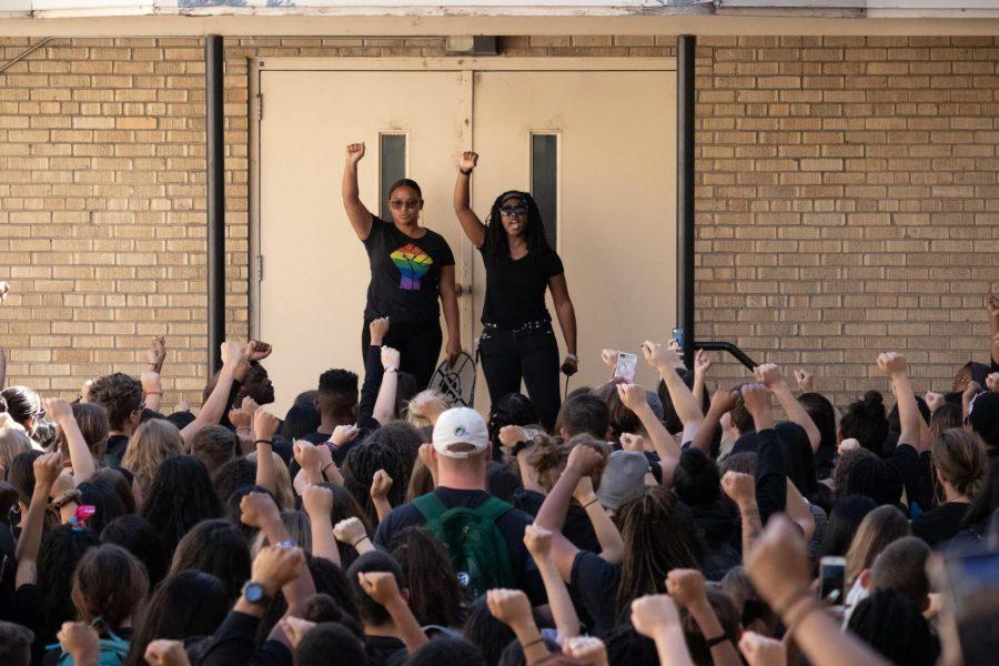 Colorado State University students Marcela Riddick and Janaye Matthews lead a meeting at Johnson Hall before the #NotProudToBe blackout event, which took place during the Fall Address Sept. 19. (Anna von Pechmann | The Collegian) 