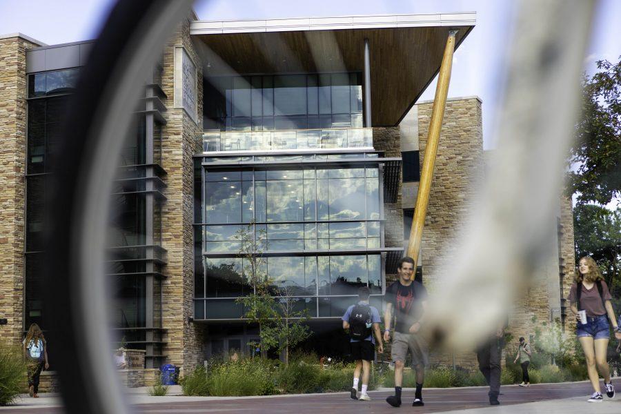 Students stream past the Micheal Smith Natural Resources Building, redesigned and reopened in 2018. (Brooke Buchan | Collegian)