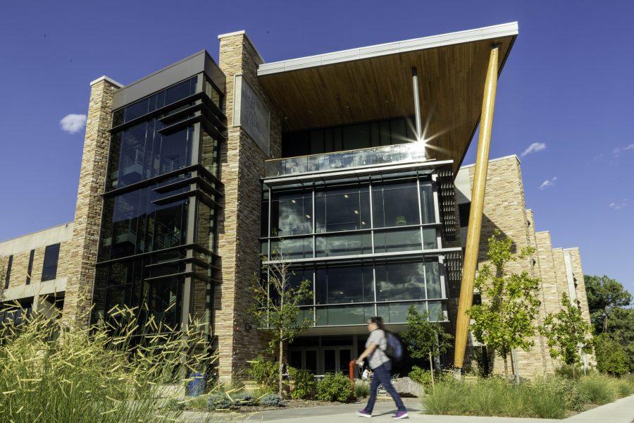 Students stream past the Micheal Smith Natural Resources Building, redesigned and reopened in 2018. (Brooke Buchan | Collegian)