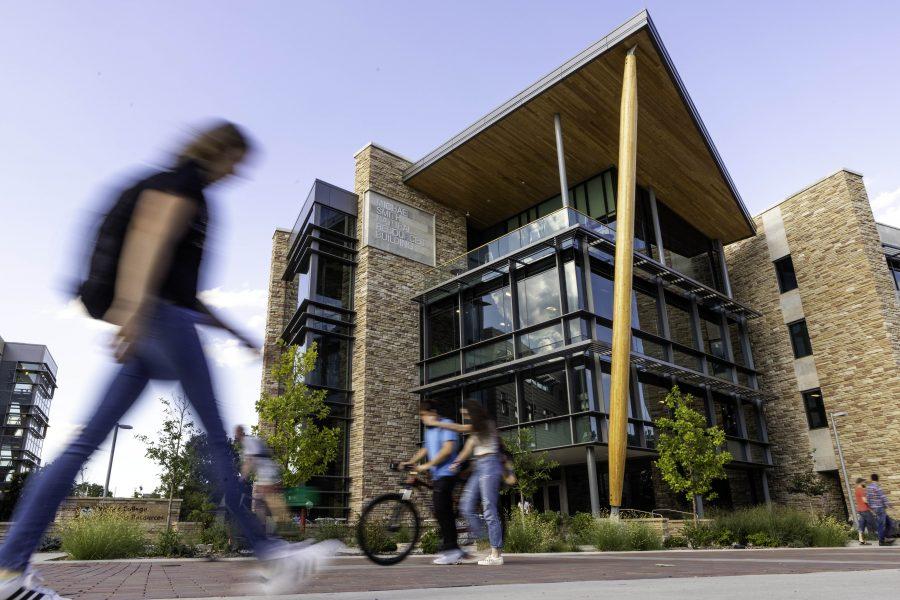 Students stream past the Micheal Smith Natural Resources Building, redesigned and reopened in 2018. (Brooke Buchan | Collegian)