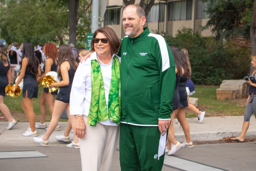 University President Joyce McConnell smiles for a photo with CSU football's head coach Mike Bobo, before a game. (Devin Cornelius | Collegian)