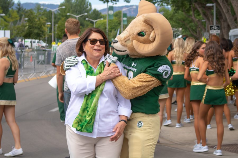 University President Joyce McConnell smiles for a photo with Cam the Ram. (Devin Cornelius | Collegian)