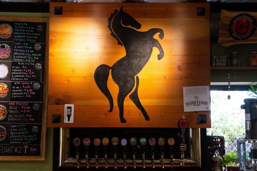 A wall inside the Horse and Dragon Brewing Company taproom, Oct. 7. Horse and Dragon hosted the Sunday Fun Day event put together by the Colorado State University Alumni Association on Oct. 6. (Matt Tackett | The Collegian)