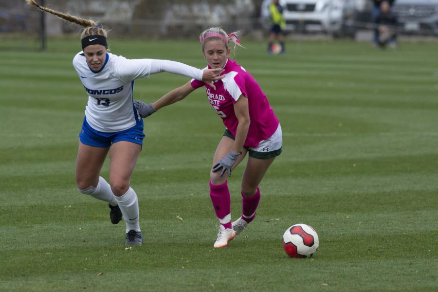 Midfielder LIv Layton dribbles the ball past Boise State defender Morgan Stone on Oct. 20. The Rams lost the game by a score of 1-0 against the visiting Broncos. (Gregory James | The Collegian)