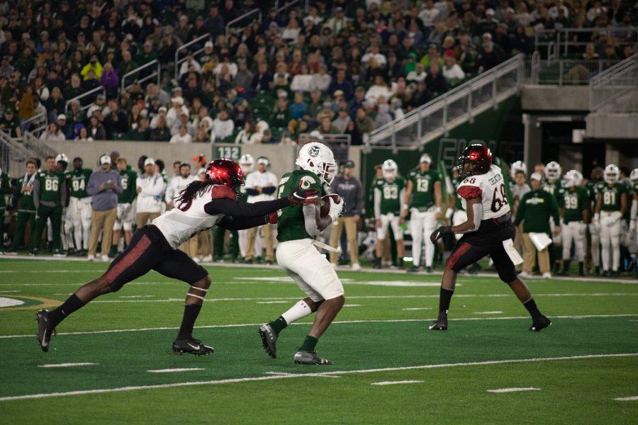 Marvin Kinsey JR.(5) catches a pass from Patrick O'Brien(12) and gets hit by a defender during the Homecoming game against San Diego State. CSU loses 24-10 (Devin Cornelius | Collegian)