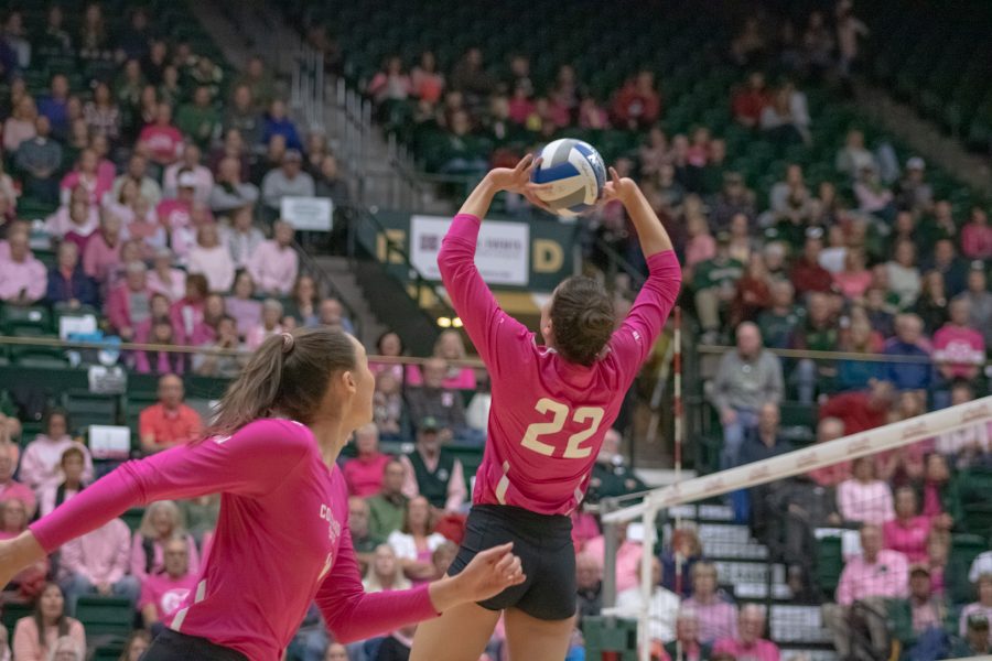 Paulina Hougaard-Jensen(11) runs towards the net as Katie Oleksak(22) backsets the ball towards her, in Colorado State's home Pink Out game against Fresno State University. CSU wins three sets to zero. (Devin Cornelius | Collegian)