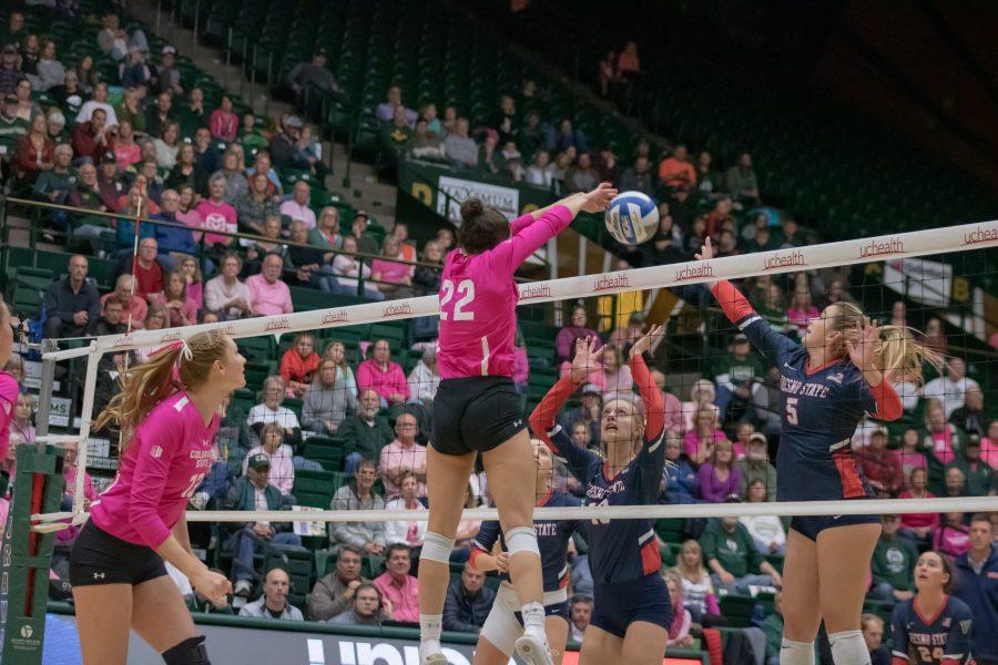 Katie Oleksak(22) pushes the ball down onto the Fresno State side for a CSU score, in the Moby Arena Pink Out game against FSU. Colorado State wins three sets to zero. (Devin Cornelius | Collegian)