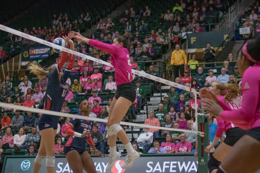 Katie Oleksak(22) pushes the ball down onto the Fresno State side for a CSU score, in the Moby Arena Pink Out game against FSU. Colorado State wins three sets to zero. (Devin Cornelius | Collegian)
