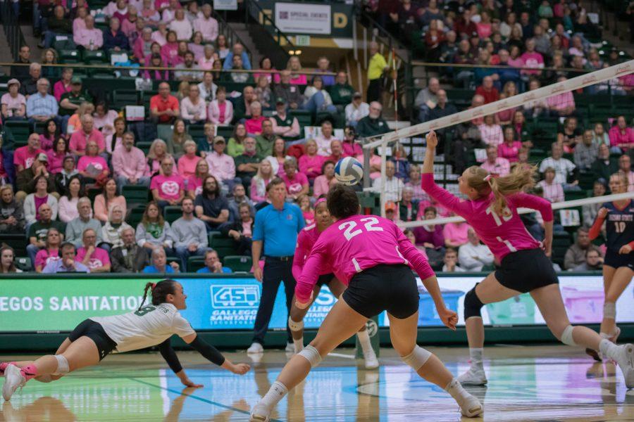 Alexa Roumeliotis(8) dives for the ball while her teammates look on, as Colorado State takes on Fresno State at Moby Arena during a Pink Out. CSU defeats FSU three sets to zero. (Devin Cornelius | Collegian)