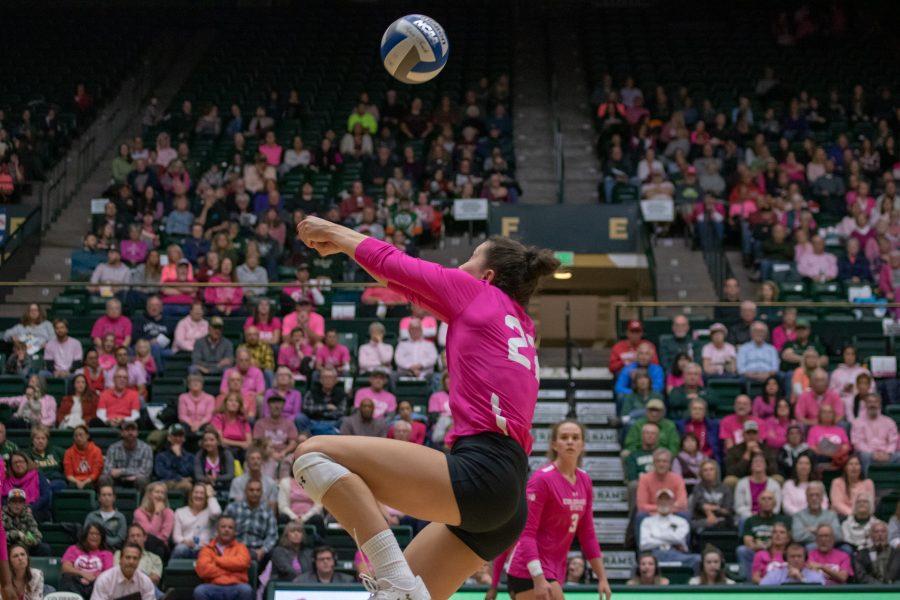 Katie Oleksak(22) bumps the ball over to her teammate, during the Colorado State Pink Out game against Fresno State University. CSU defeats FSU three sets to zero. (Devin Cornelius | Collegian)