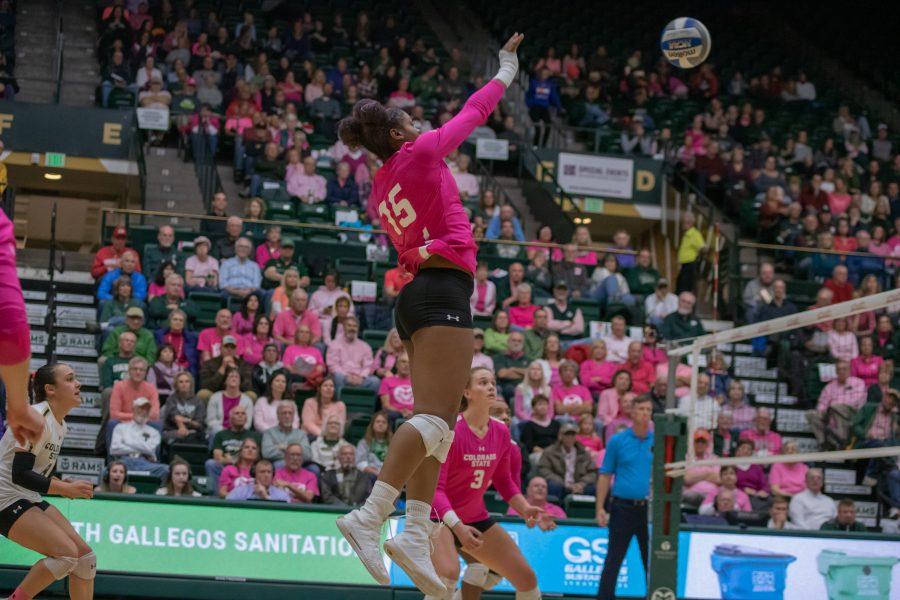 Breana Runnels(15) spikes the ball toward the Fresno State's defenders, during the CSU Pink Out game against FSU. CSU wins three sets to zero. (Devin Cornelius | Collegian)