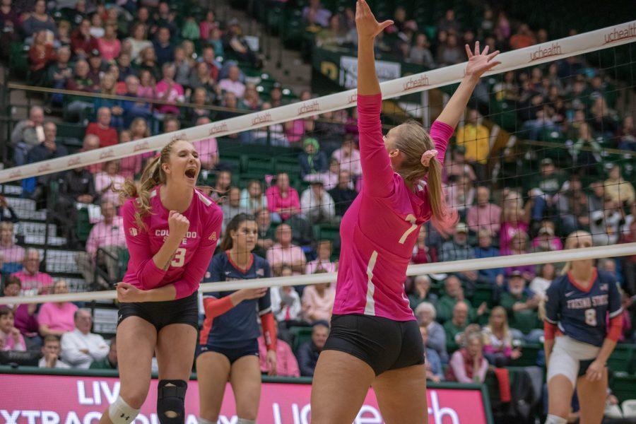 Kirstie Hillyer(13) celebrates  
with Sasha Colombo(7) after Sasha scores a point for Colorado State, during the CSU Home Pink Out game against Fresno State. CSU wins three sets to zero. (Devin Cornelius | Collegian)