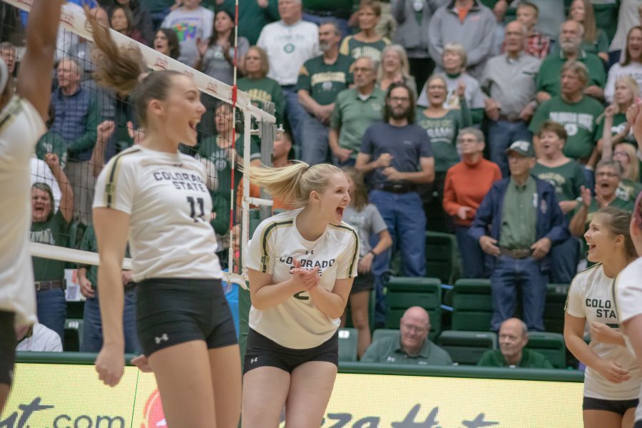 Ellie Gubser(#2) Celebrates with her team after scoring the game winning point, during Colorado State's home game against San Diego State. CSU wins three sets to zero. (Devin Cornelius | Collegian)